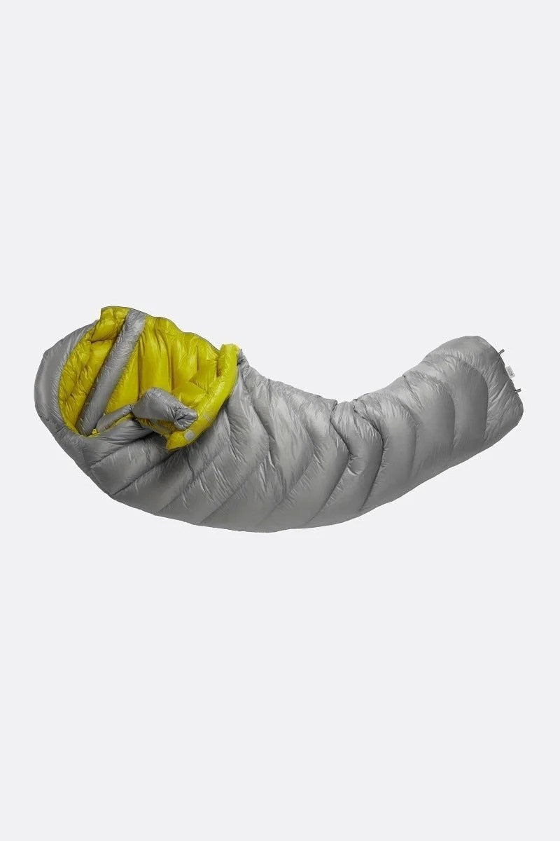 Casavibeo Rab Mythic 600 Down Sleeping Bag displayed outdoors, showcasing its lightweight, insulated design for cold weather camping.