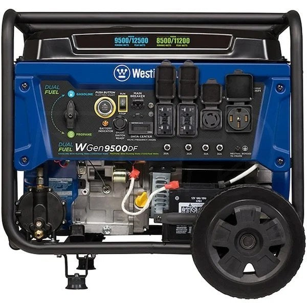 DuroMax DS12000EH 12,000 Watt dual fuel portable generator with control panel and fuel tanks, used outdoors for power backup.