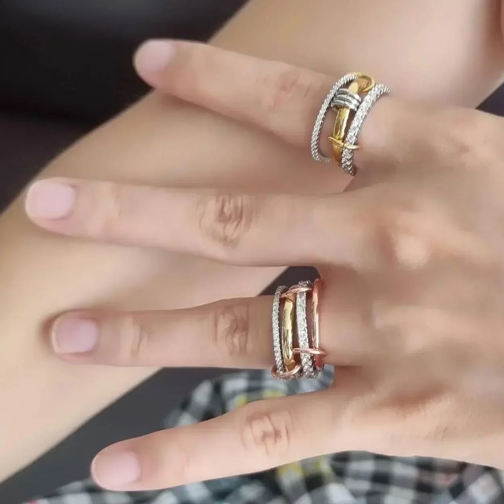 Set of trendy gold stackable rings by Belro, featuring multiple slim gold bands perfect for stacking or wearing alone.