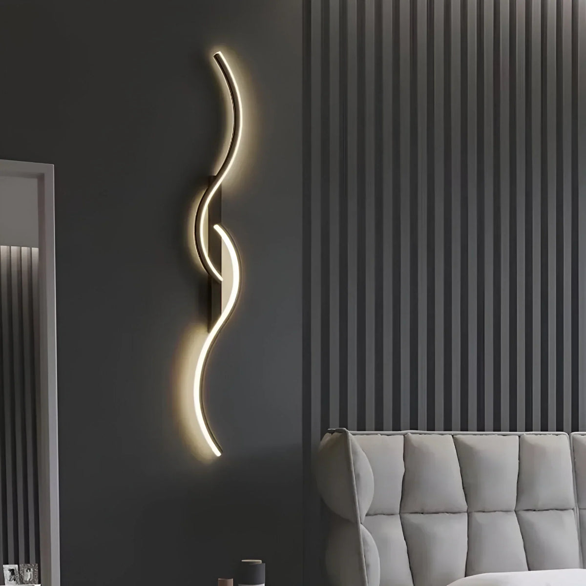 Modern BowLift curved LED wall light for indoor ambient lighting, plug-in design, sleek contemporary wall fixture.