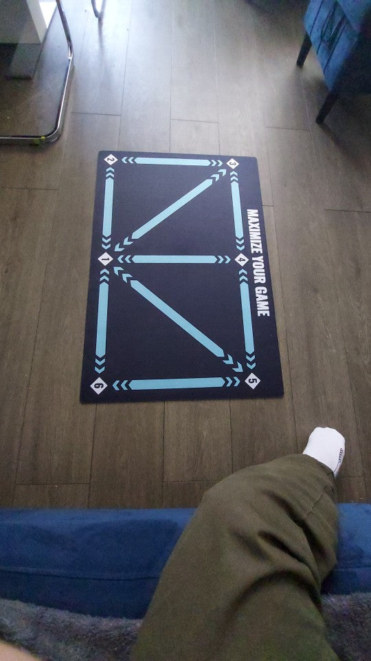 Belro children's soccer training mat laid out on grass, featuring colorful markings for sports practice and skill development.