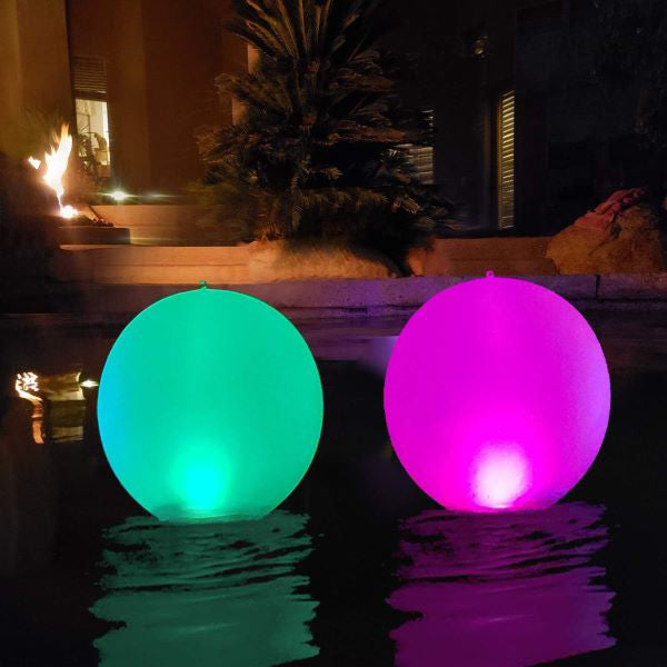 Belro inflatable waterproof pool lamp floating in a swimming pool, providing colorful outdoor lighting for home and garden use.