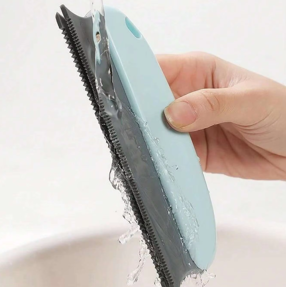 Belro pet hair remover for furniture showing a hand using the grooming tool to lift pet hair from a sofa surface.