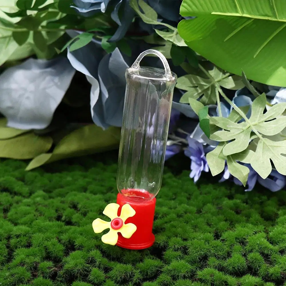 Belro leak-proof plastic hummingbird feeder with vibrant red flowers and clear feeding ports, designed for outdoor garden decor.