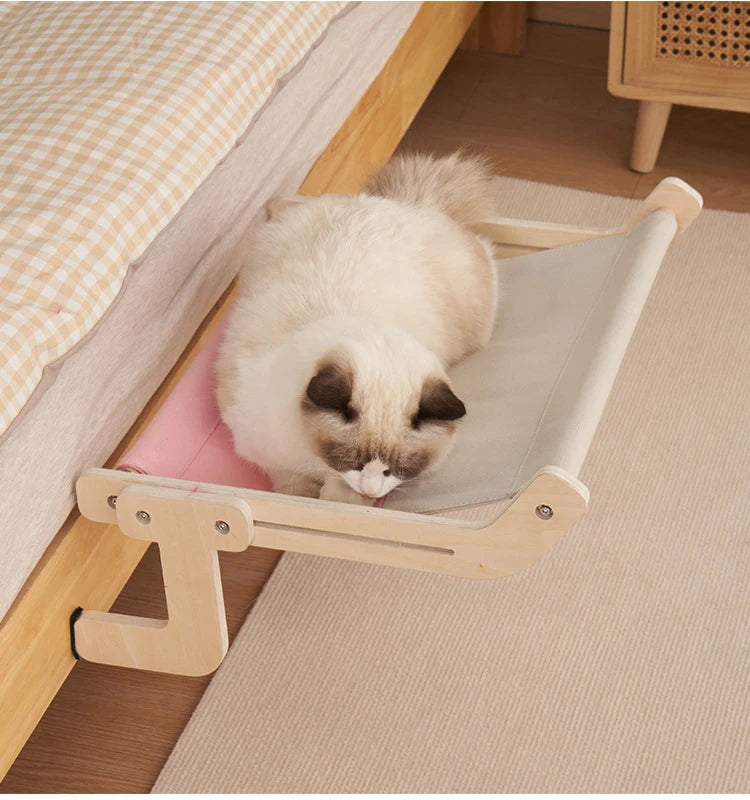 Belro wooden cat hammock bed hanging outdoors, featuring a cozy wooden frame and soft fabric for comfortable outdoor cat lounging.