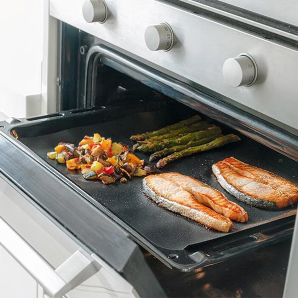 Belro Chef non-stick BBQ grill mat laid out on a kitchen counter, designed for grilling and barbecue cooking.