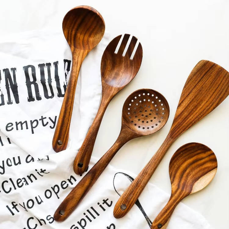 Six-piece wooden utensils set by Belro, including spoons and spatulas, displayed on a kitchen countertop for home and dining use.