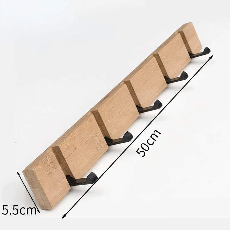 Wooden wall-mounted coat rack with hidden hooks by Belro, featuring a sleek design for hanging jackets and coats.