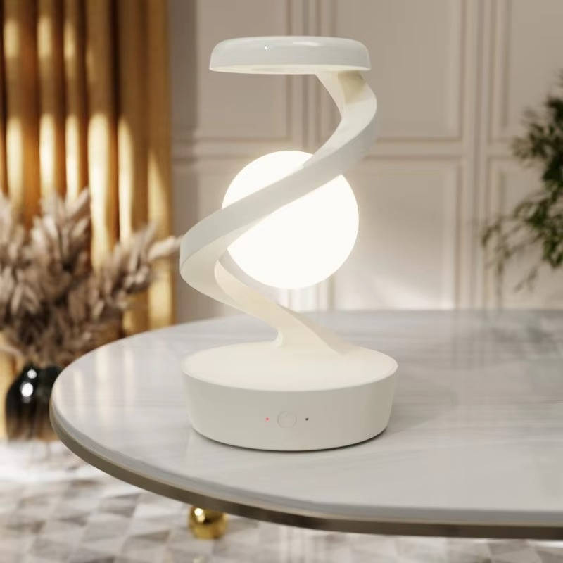 Belro levitating moon lamp with gesture control and wireless charging, glowing moon shape floating above a base.