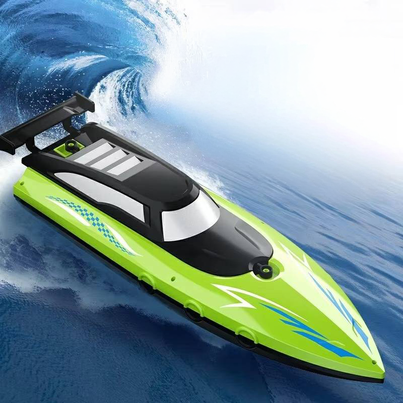 Green Belro RC boat for toys and games, featuring a sleek design and remote control for outdoor water play.