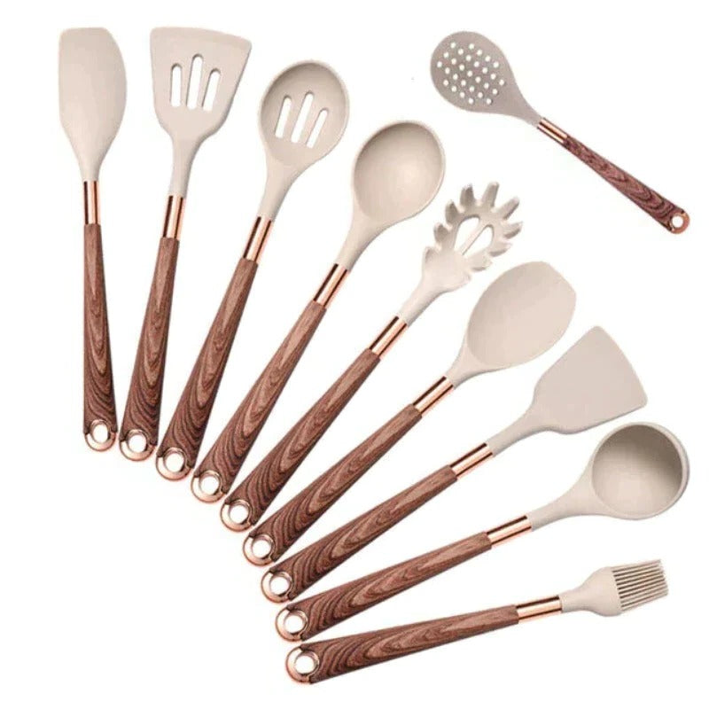 Belro kitchen utensil set with spatulas, spoons, and tongs arranged on a countertop for cooking and baking.