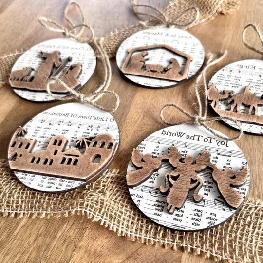 Belro nativity-themed music sheet ornament collection featuring detailed designs, perfect for Christmas holiday decoration.