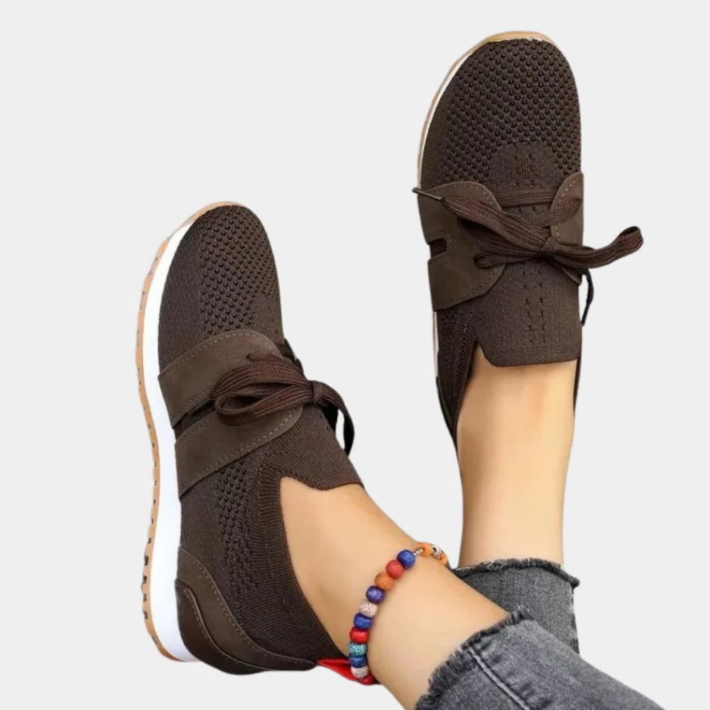 Belro women's stylish sneakers with white and pastel accents, featuring a sleek design and comfortable athletic footwear.
