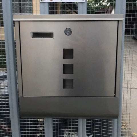 Large heavy-duty metal lockable mailbox mounted on wall, designed for secure home mail delivery, by Belro.