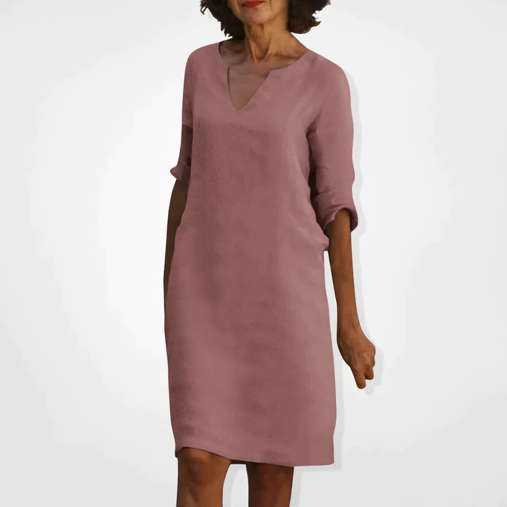 Belro summer dress with a V-neck, sleeveless design, lightweight fabric, and flowy silhouette perfect for warm weather.