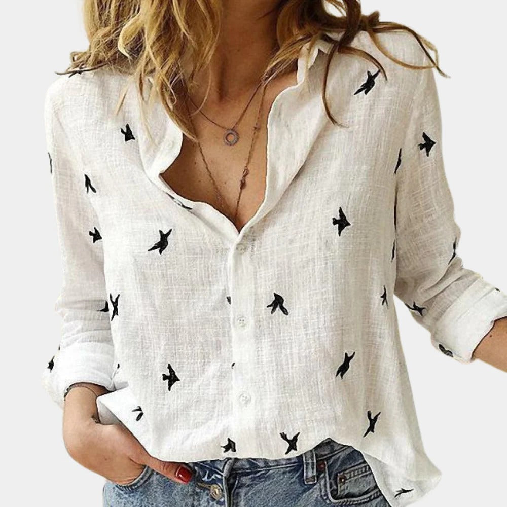 Women's long sleeve shirt by Belro, featuring a soft, fitted design in a neutral color, displayed on a hanger.