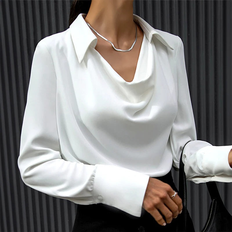 Elegant silk blouse for women by Belro, showcasing a stylish, smooth fabric top with a classic collar and button details.