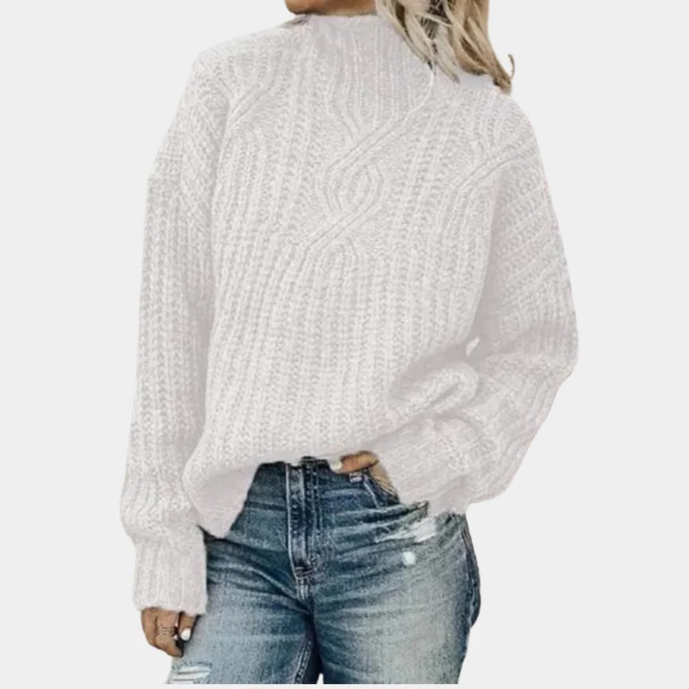 Soft knitted women's sweater by Belro, featuring a cozy fit and ribbed cuffs in a neutral color.
