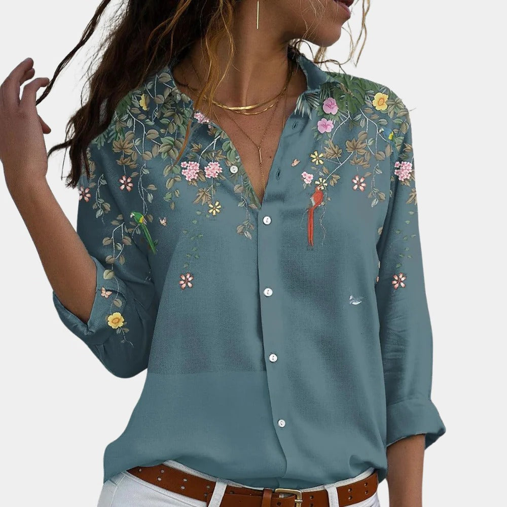 Floral Belro ladies blouse with long sleeves and a vibrant floral pattern, stylish top for women’s casual or office wear.
