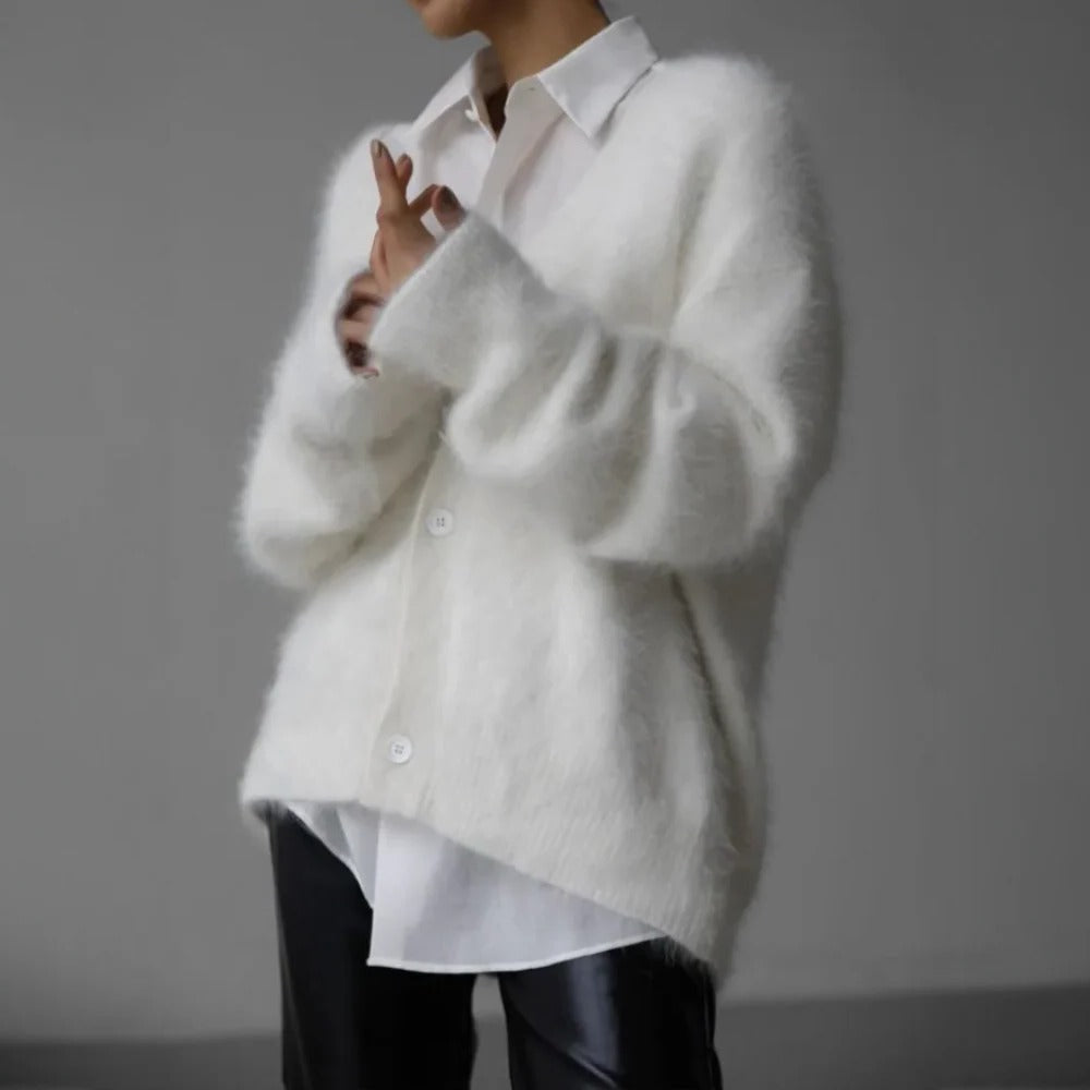 Soft Belro cashmere sweater for women, cozy and high-quality, in a classic style, displayed on a neutral background.