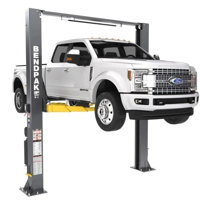 Casavibeo BendPak 12APX-192 12,000 lb clearfloor two-post lift with sturdy metal arms and hydraulic lifting mechanism.