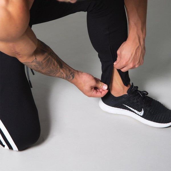 Slim-fit Belro banded joggers in black, featuring a tapered design and elastic waistband, perfect for casual or athletic wear.