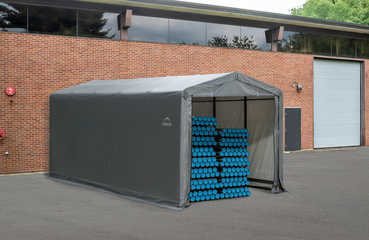 Tan ShelterTube garage tent, 10x14x8 feet, wind and snow-load rated, by Casavibeo, shown set up outdoors with sturdy frame and fabric cover.