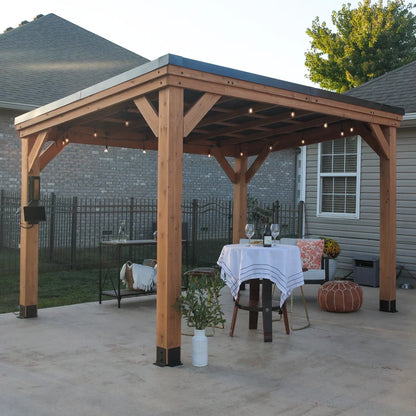 Casavibeo Backyard Discovery 12x9.5 ft Arcadia cedar wood gazebo with steel roof and built-in PowerPort™ for outdoor relaxation.