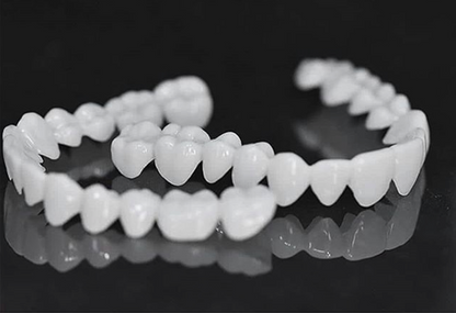 Flexible dental prosthesis by BowLift, natural-looking fit and pain-free comfort, shown in a close-up image of the prosthesis.