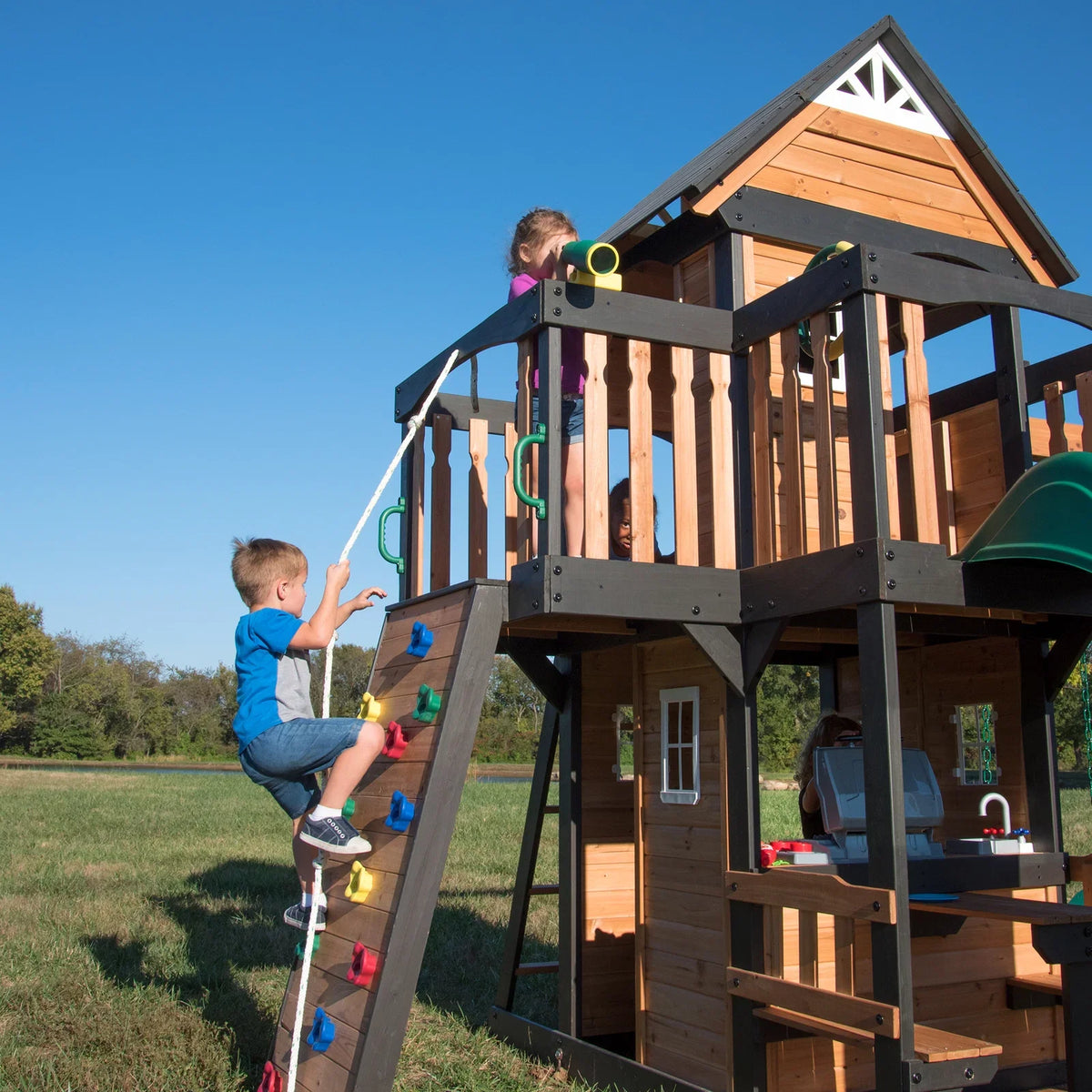 Casavibeo Canyon Creek Swing Set with colorful swings and sturdy frame, set up outdoors on a grassy area.