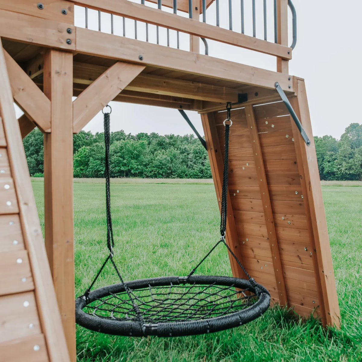 Casavibeo Sterling Point Swing Set in a backyard, featuring a sturdy frame, colorful swings, and a slide for children's outdoor play.
