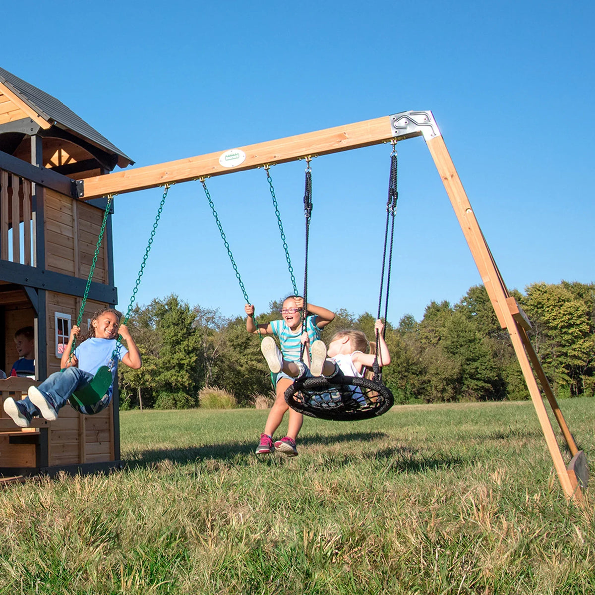 Casavibeo Canyon Creek Swing Set with two swings and slide, outdoor playset for kids with sturdy wooden frame and colorful accessories.