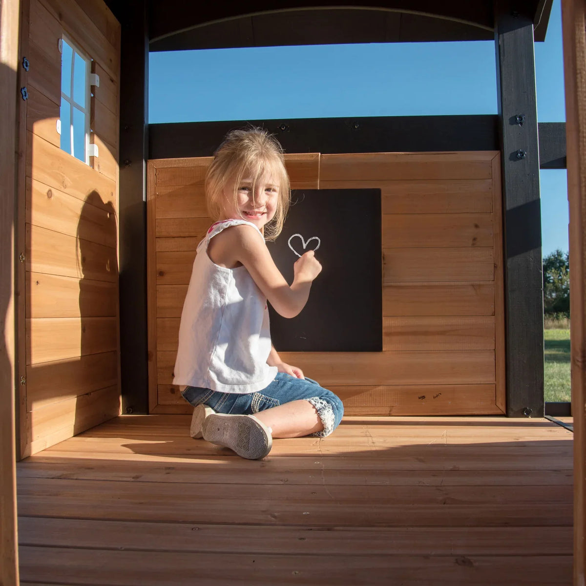 Casavibeo Canyon Creek Swing Set installed in a backyard with children playing on the swings and slide, outdoor play equipment setup