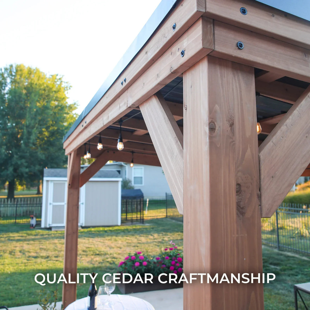 Cedar wood backyard gazebo with 12x9.5 ft Arcadia design, steel roof, and PowerPort™ for outdoor relaxation and shade.