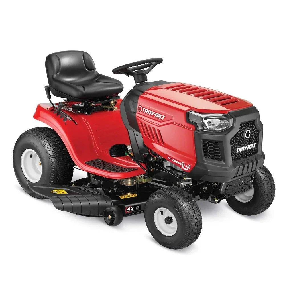 Casavibeo Troy-Bilt Bronco 42-inch riding lawn mower with cutting deck, seat, and control panel in a green outdoor setting.