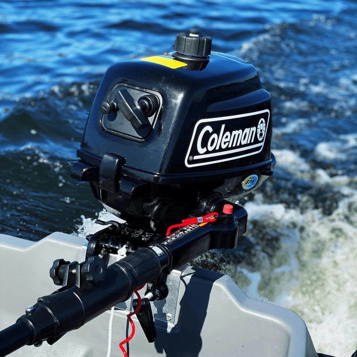 Casavibeo Coleman Powersports 5 HP 4-stroke outboard boat motor with easy pull start, black and silver engine with control handles.