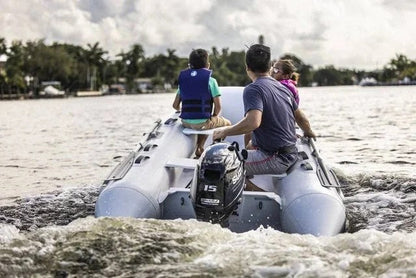 Suzuki 15 HP outboard motor DF15AS5 by Casavibeo, showing the engine with control handles and mounting bracket.