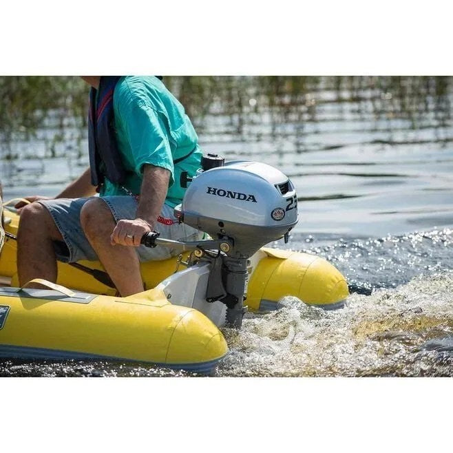 Casavibeo Honda BF2.3 outboard motor shown in a detailed side view, featuring compact design and control handle.