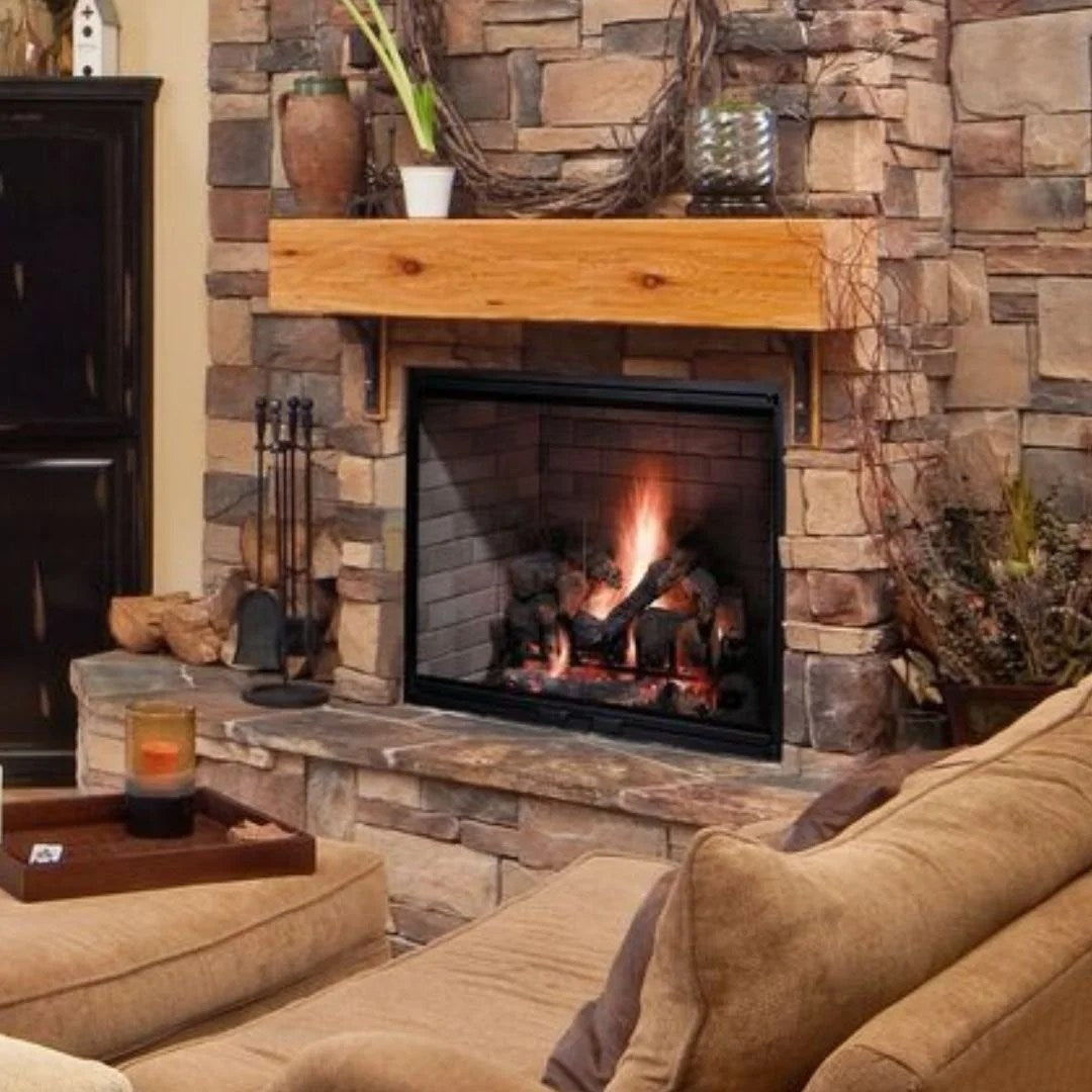 Casavibeo Majestic Biltmore 36-inch radiant wood burning fireplace with a stone surround and glowing fire inside.
