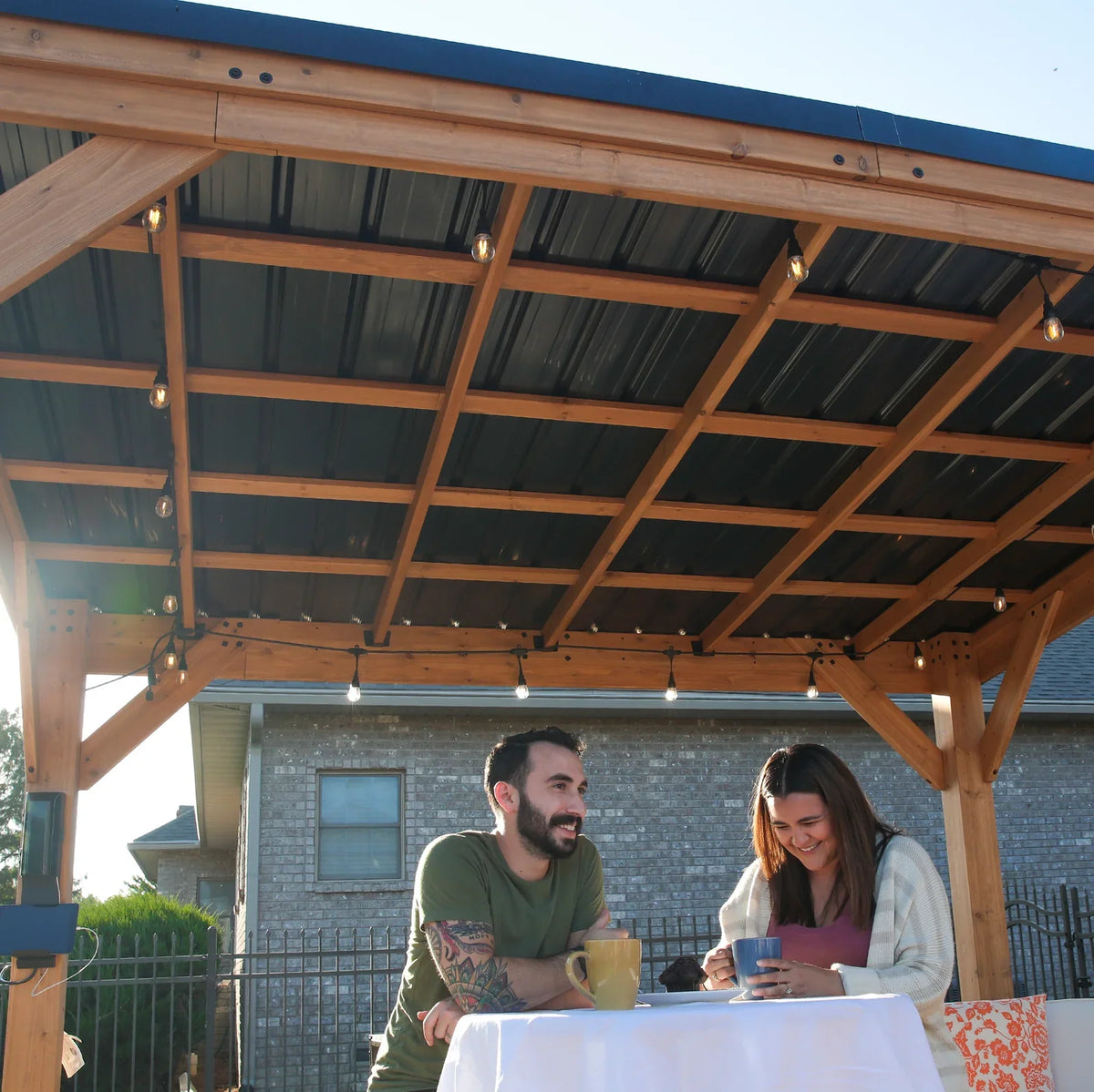 Casavibeo Backyard Discovery 12x9.5 ft Arcadia cedar wood gazebo with steel roof and PowerPort™ for outdoor relaxation.