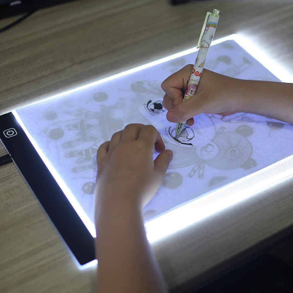Belro A4 A5 ultra-thin LED drawing tablet for tracing and sketching, shown on a desk with stylus ready for creative use.