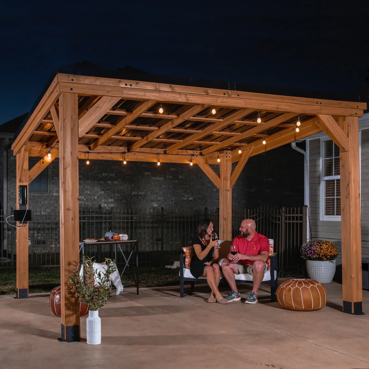 Casavibeo Backyard Discovery 12×9.5 cedar wood Arcadia gazebo with steel roof and PowerPort™, shown in a backyard setting
