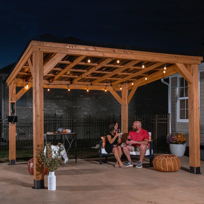 Casavibeo Backyard Discovery 12×9.5 cedar wood Arcadia gazebo with steel roof and PowerPort™, shown in a backyard setting
