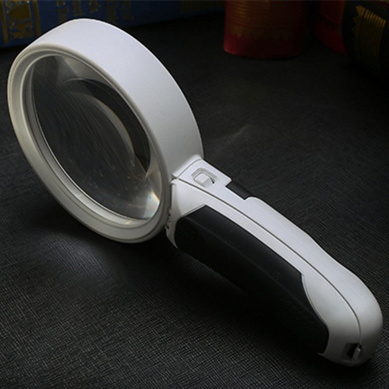 Belro optical magnifying glass for electronics and optics, showing a close-up view of the lens and handle in a well-lit setting.