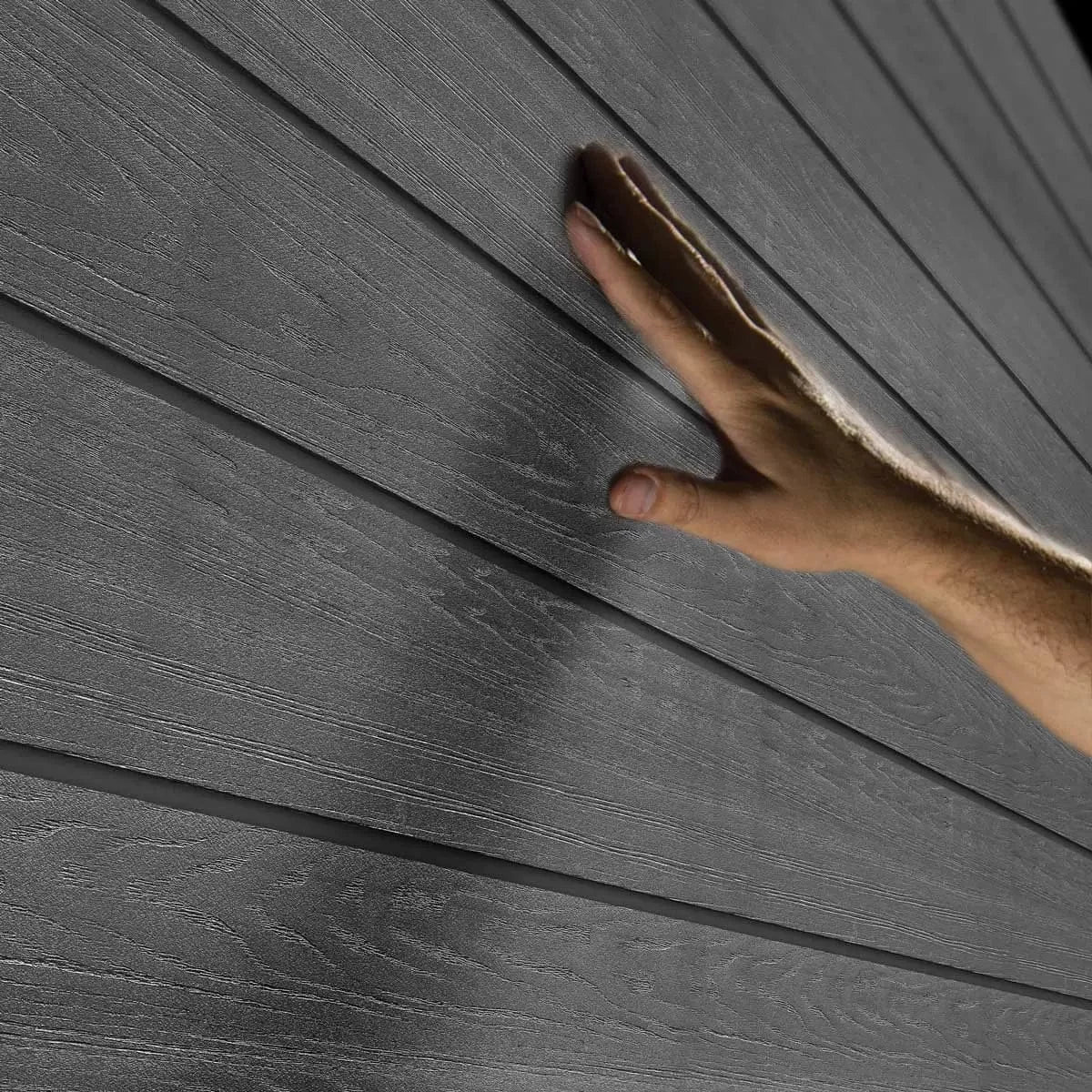 Keter Artisan 11x7 ft outdoor storage shed by Casavibeo in dark grey with window and floor, shown from the front.
