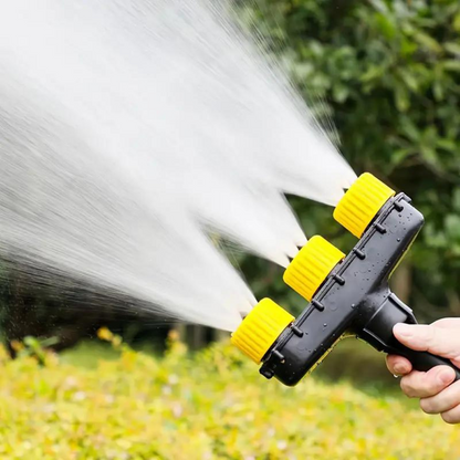 Belro garden atomizer nozzle attachment connected to a garden hose, used for watering and garden spraying tasks.