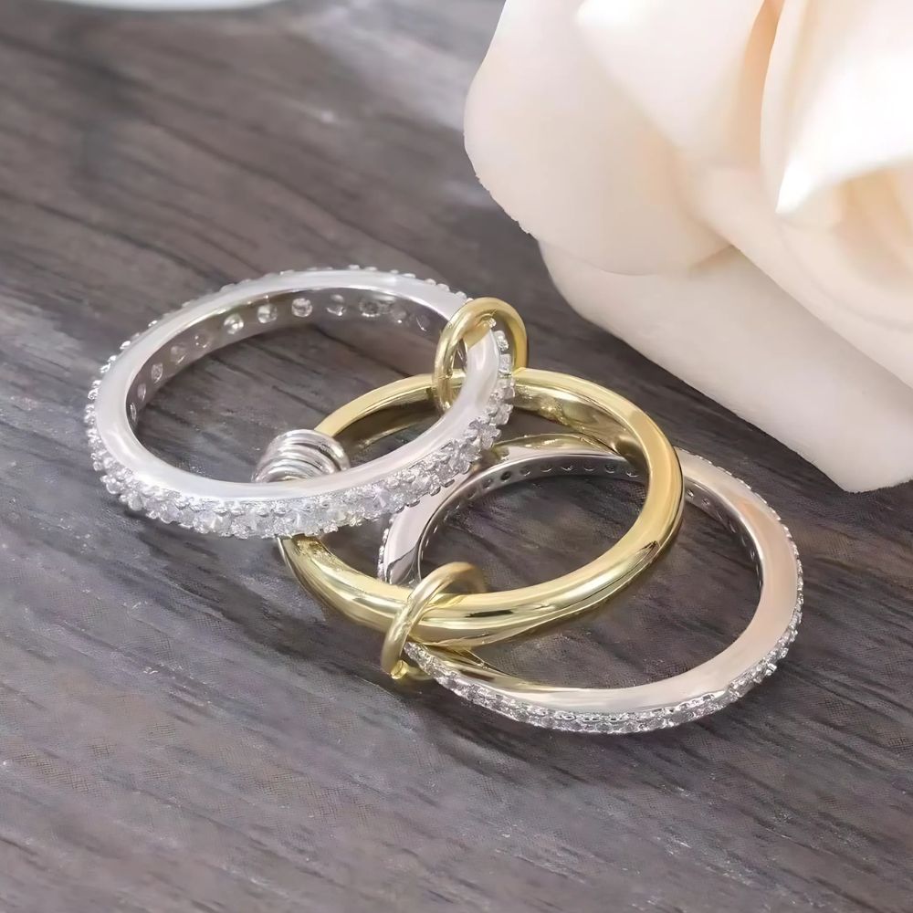 Belro trendy gold stackable rings displayed on a hand, showcasing layered gold jewelry for fashionable accessories.