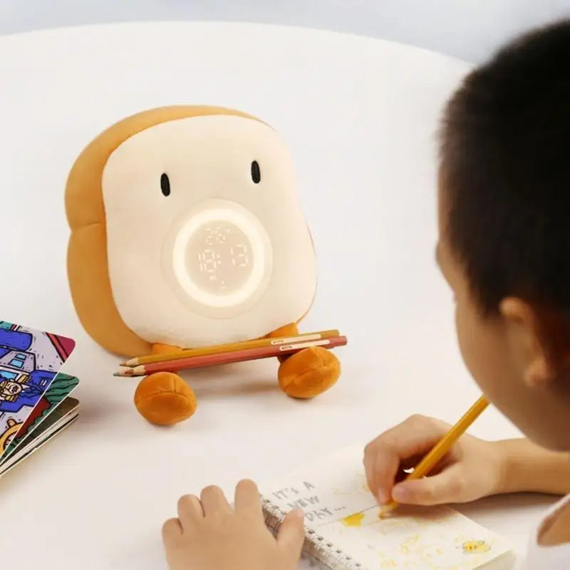 Belro alarm clock plushie with integrated night light, soft fabric and cute design perfect for bedside decor and nighttime comfort.