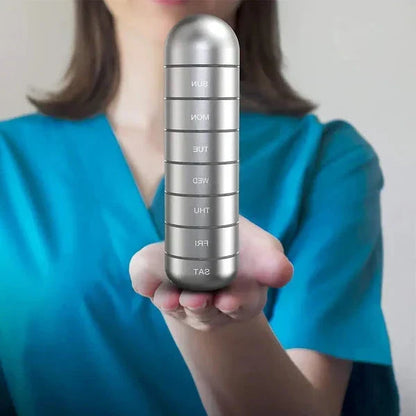 Belro aluminum 7-day portable pill organizer with seven compartments for travel and daily medication storage.
