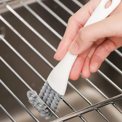 Belro V-shaped barbecue grill brush with scraper, metal bristles and ergonomic handle for cleaning outdoor grills.
